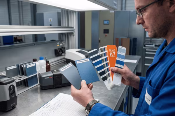 Custom color matching of PPGI steel samples against RAL and Pantone reference swatches