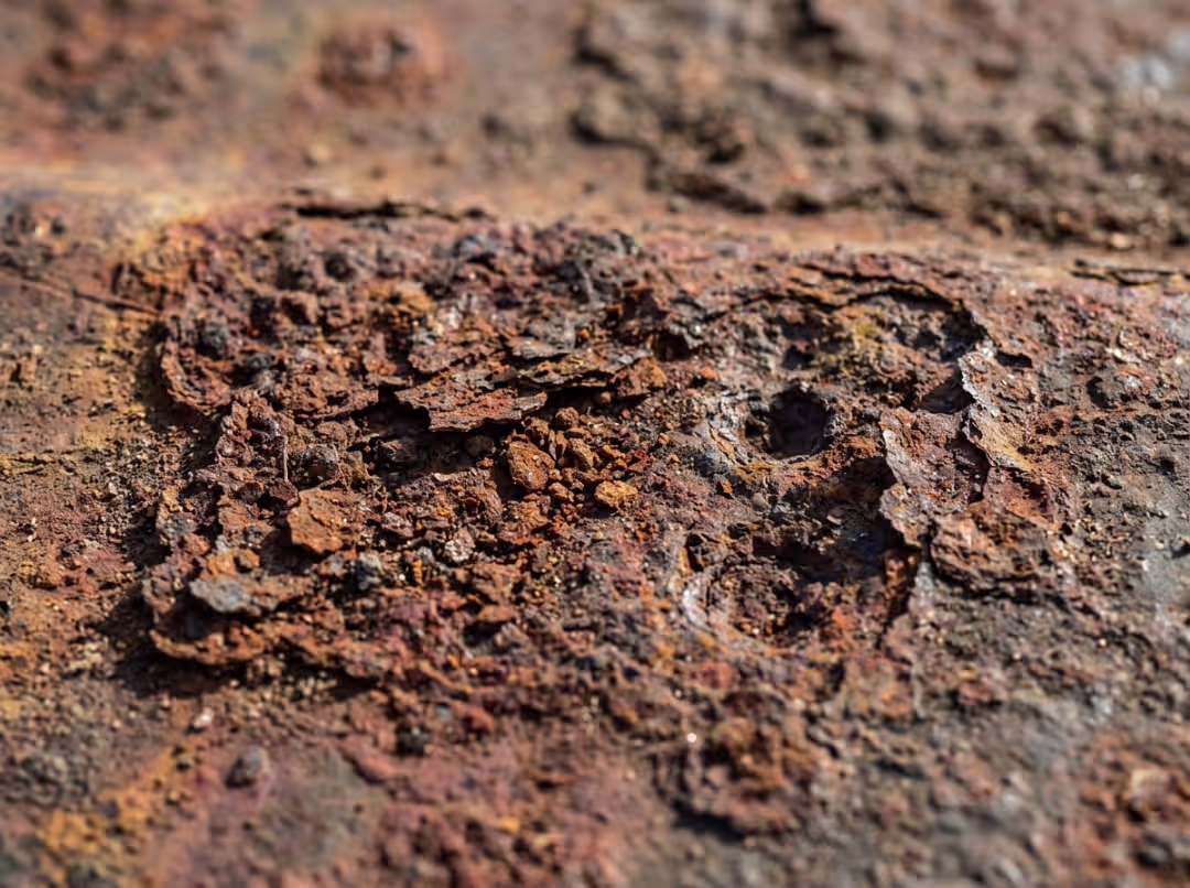 Close up of rust and pitting on steel Close up of rust and pitting on steel
